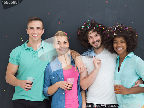 Image of confetti party multiethnic group of people isolated over gray