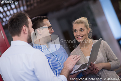 Image of Business team Working With laptop in creative office