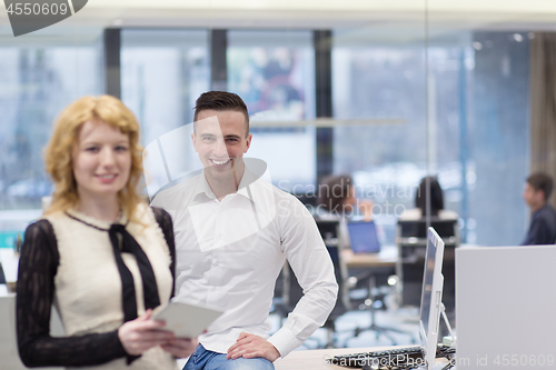 Image of Business People Working With Tablet in startup office