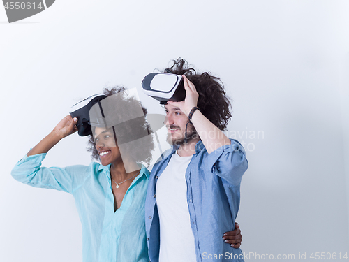 Image of multiethnic couple getting experience using VR headset glasses