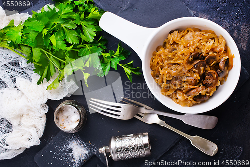 Image of fried cabbage with mushrooms