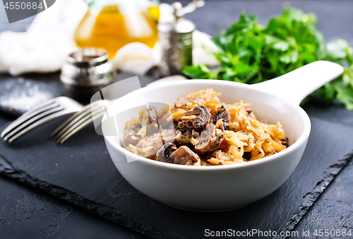 Image of fried cabbage with mushrooms