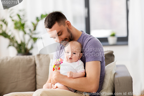 Image of happy father with little baby daughter at home