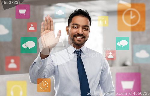 Image of indian businessman making high five gesture