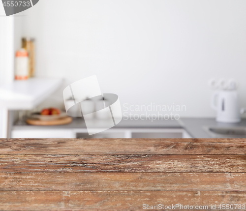 Image of blurred kitchen background with wooden boards