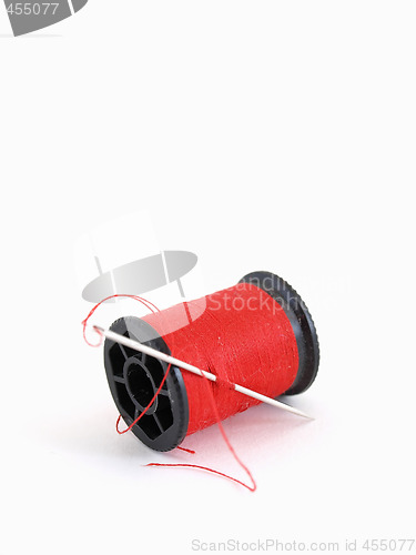 Image of Spool and Red Thread