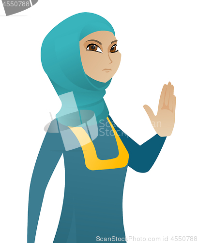 Image of Young muslim business woman showing palm hand.