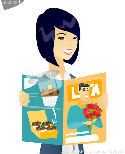 Image of Young asian business woman reading magazine.