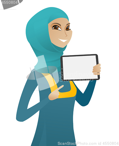 Image of Muslim business woman holding tablet computer.