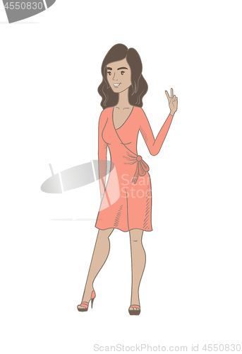 Image of Young hispanic woman showing victory gesture.