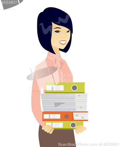 Image of Young asian business woman holding pile of folders