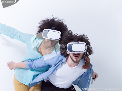 Image of multiethnic couple getting experience using VR headset glasses