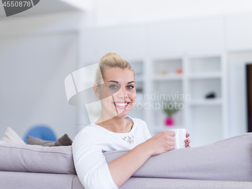 Image of woman enjoying a cup of coffee