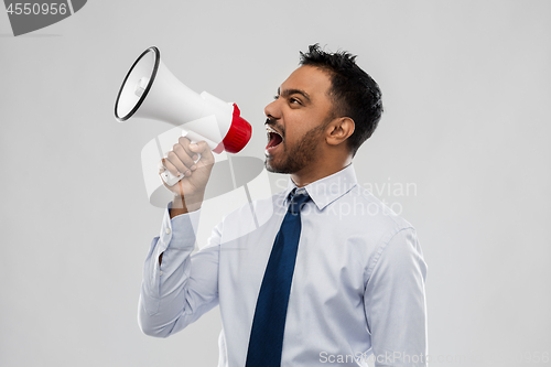 Image of indian businessman screaming over grey