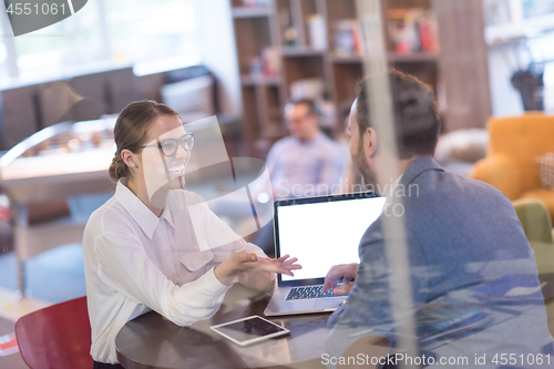 Image of Business team Working With laptop in creative office