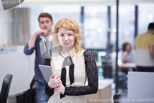 Image of Business People Working With Tablet in startup office