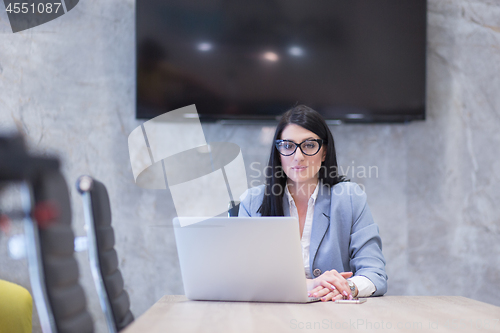 Image of businesswoman using a laptop in startup office