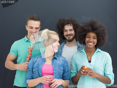 Image of confetti party multiethnic group of people isolated over gray