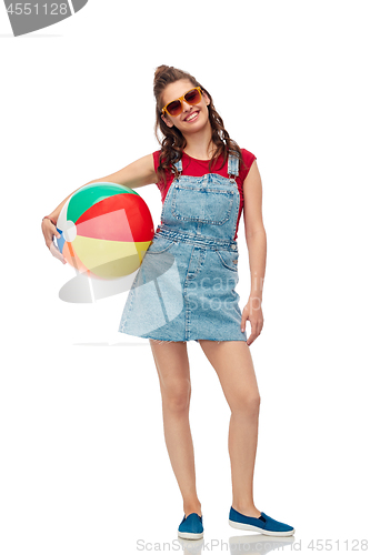 Image of smiling teenage girl in sunglasses with beach ball