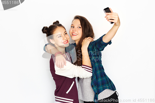 Image of happy teenage girls taking selfie by smartphone