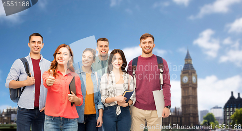 Image of group of students showing thumbs up over london