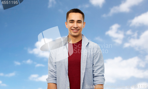 Image of smiling young man over white background