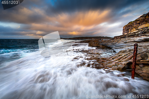 Image of Waves washing up along the rocks of Bare Island