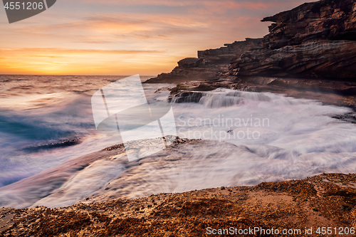 Image of Large waves smash against the rocky roastline of Sydney