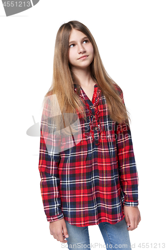 Image of Teen girl in checkered shirt standing casually