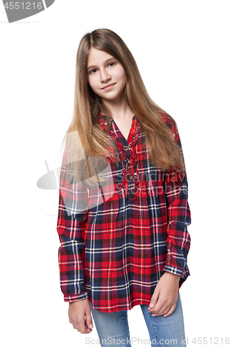 Image of Teen girl in checkered shirt standing casually