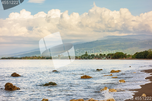 Image of a dark sand beach in northern Bali Indonesia