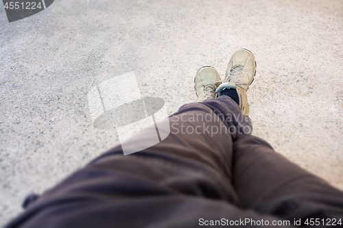 Image of shoes of a man having a rest