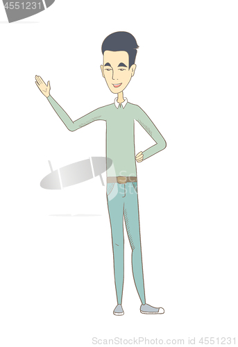 Image of Young asian man pointing at something by his hand.