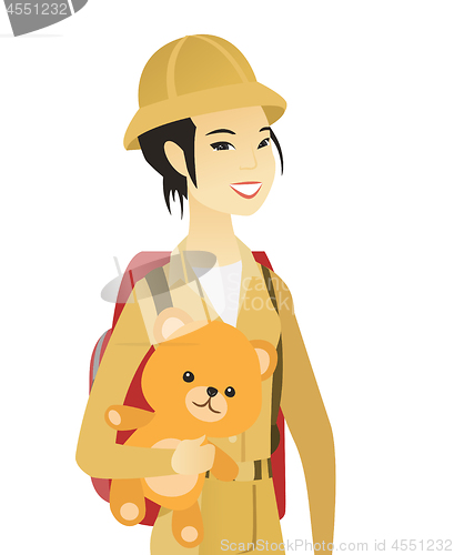 Image of Young asian woman traveling with teddy bear.