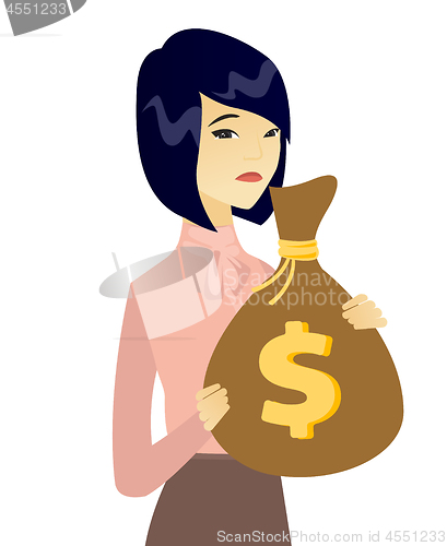 Image of Upset asian business woman with bag full of taxes.