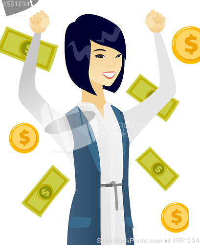 Image of Young asian business woman under money rain.