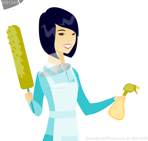 Image of Asian housemaid holding spray bottle and duster.