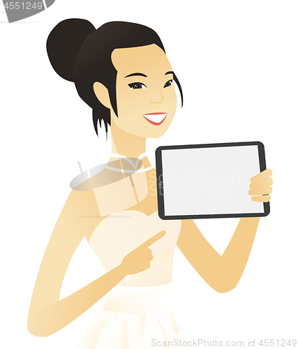 Image of Young asian fiancee holding tablet computer.