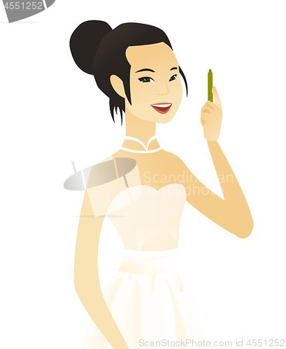 Image of Young asian smiling fiancee with pen.