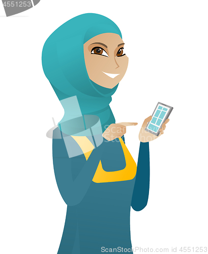 Image of Young muslim business woman holding mobile phone.