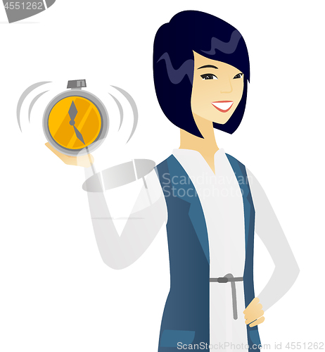 Image of Young asian business woman holding alarm clock.
