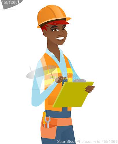 Image of Young african building inspector with clipboard.