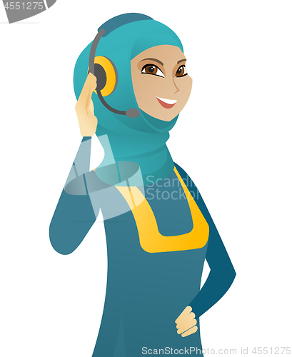 Image of Young muslim customer service operator in headset.