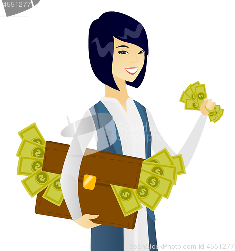 Image of Asian business woman with briefcase full of money.