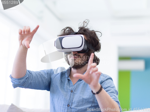 Image of man using VR-headset glasses of virtual reality