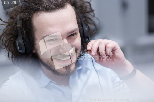 Image of male call centre operator doing his job