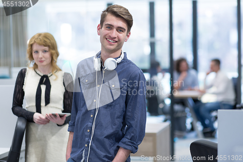 Image of Business People Working With Tablet in startup office