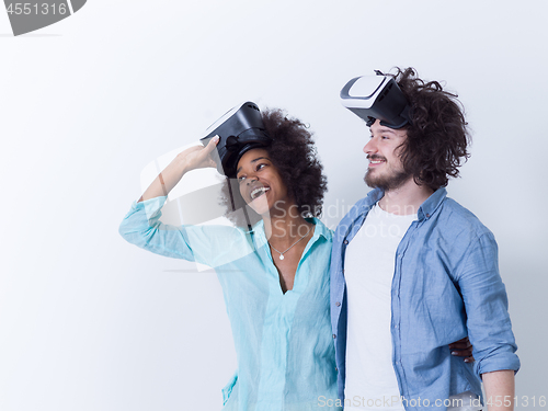 Image of multiethnic couple getting experience using VR headset glasses