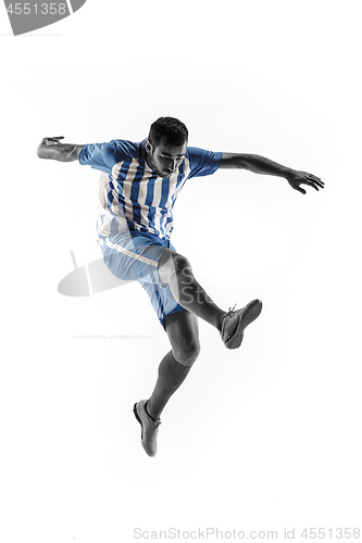 Image of Professional football soccer player in action isolated on white background
