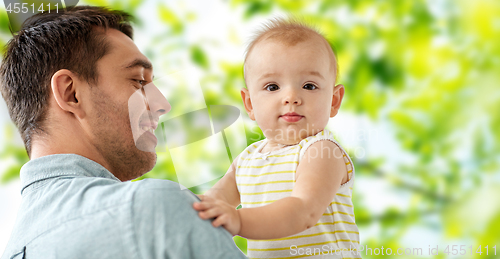 Image of father with little baby daughter